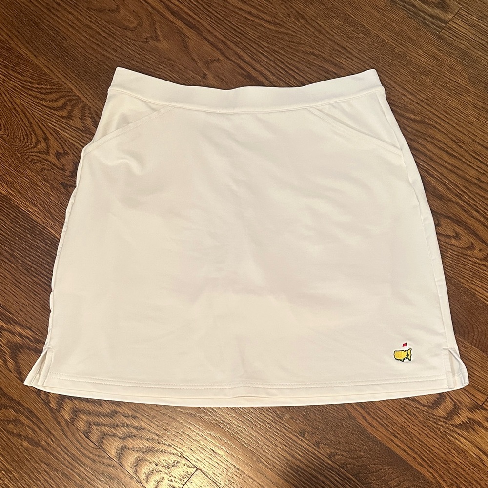 White Women's Golf Skort with Embroidered Yellow Icon
